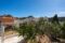 Villa im Ibiza-Stil mit Garten und Dachterrasse in Paguera - Frontansicht vom Grundstück