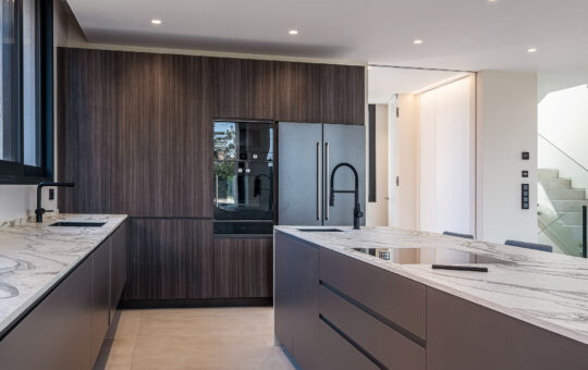 Modern new build villa above Port Adriano - Open fitted kitchen