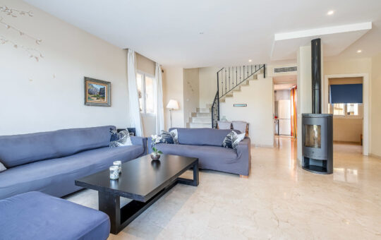 Beautiful family villa in the quiet village of Es Capdellà with holiday rental licence - Living room with fireplace