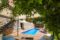 Villa mit traumhaftem Panoramablick - Loungebereich mit Blick auf den Pool