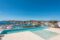 Lujosa villa de nueva construcción en 1ª línea de mar - Piscina infinita con solárium y vistas a Port Adriano
